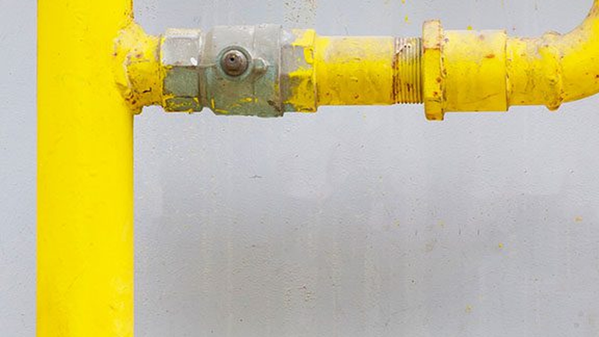 Yellow residential gas pipe and shutoff valve